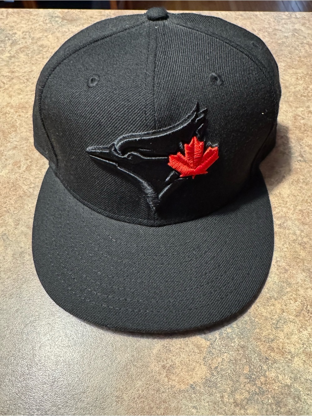 New Era Black Fitted Cap with Red Maple Leaf Accent